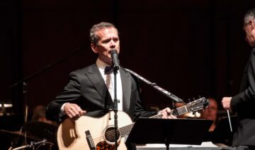 Chris Hadfield playing guitar with the Windsor Symphony Orchestra