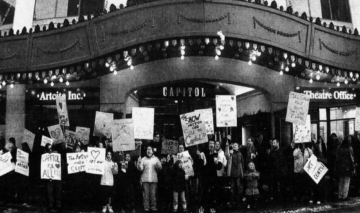 Newspaper clipping. Protestors in front of the Capitol Theatre.