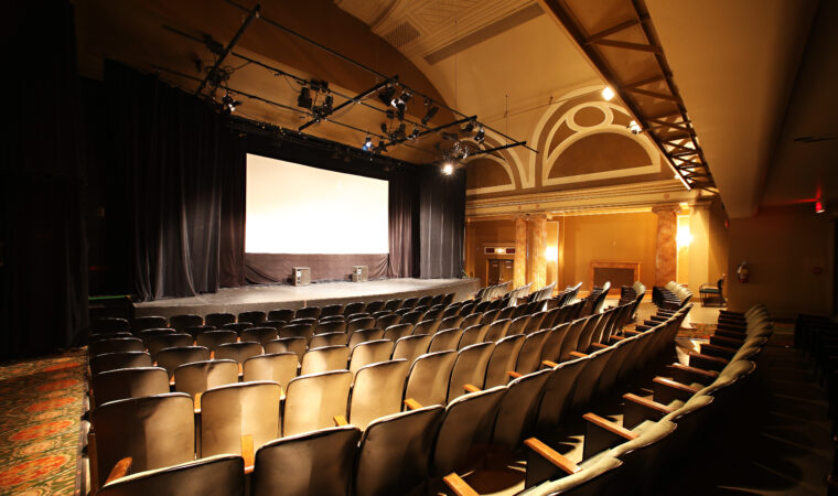 Medium sized empty movie theatre. 